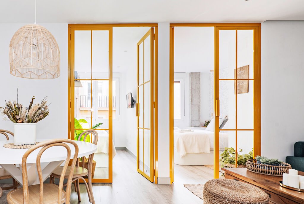 Yellow crittall style doors made of glass and steel 